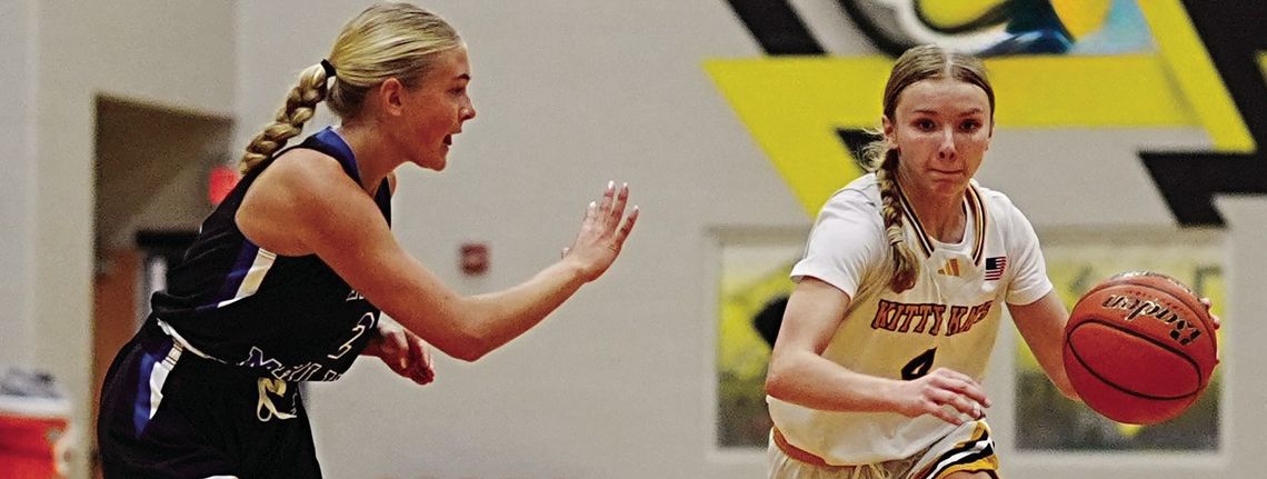 Kitty Kat freshman Palyn Koopmann drives on a Port Aransas player. PHOTOS BY VALERIE STUART