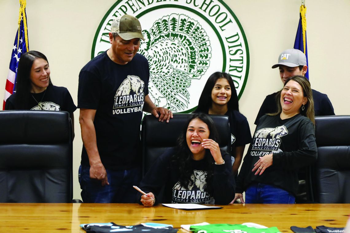 Lady Gobblers commit to college teams Sarah Rodriguez and her family break out in laughter during her signing ceremony to play for Temple College. (Staff Photos)