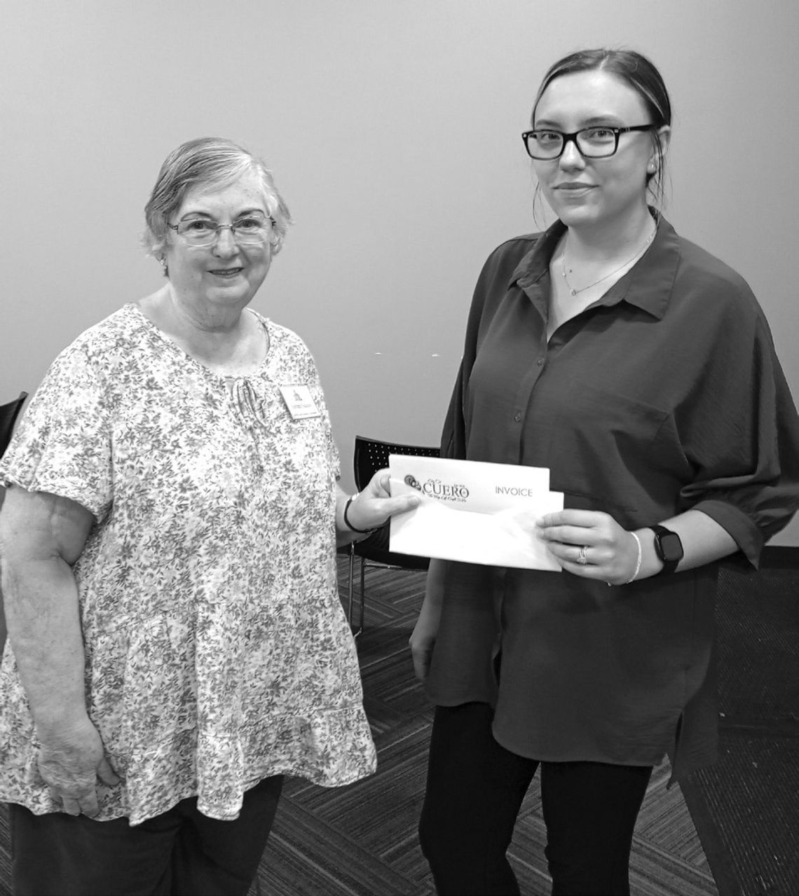 Barbara Nuchels with the DeWitt County Historical Commission delivers a donation of $856.98 to Librarian Katelynn Meitzen for half the cost of the Ancestry Library Edition, which is available for use free of charge at the Cuero Municipal Library. (Contributed photo)