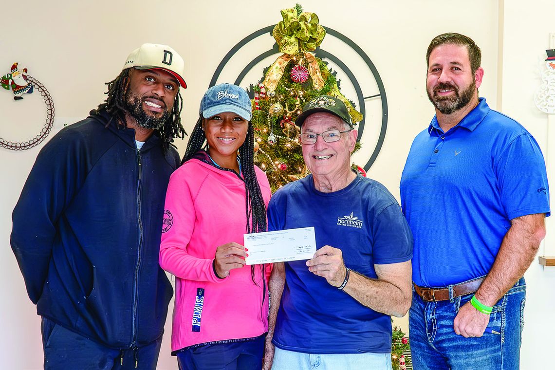 Hochheim Prairie Insurance Branch 2 donates $200 to Cuero’s Little Dribblers' program. Pictured L-R:Terrence Coulter, Cuero Little Dribblers president; Ashakoy Coulter, secretary; Hochheim Prairie President Ronnie Dietz and board member Will Carbonara (Photo by Ele Chew)