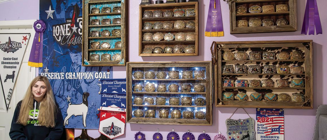 Senior Briley Wieland has earned a wall full of awards for showing her goats and lambs throughout the state. She now looks forward to helping young competitors show their animals. (Photo by Ele Chew)
