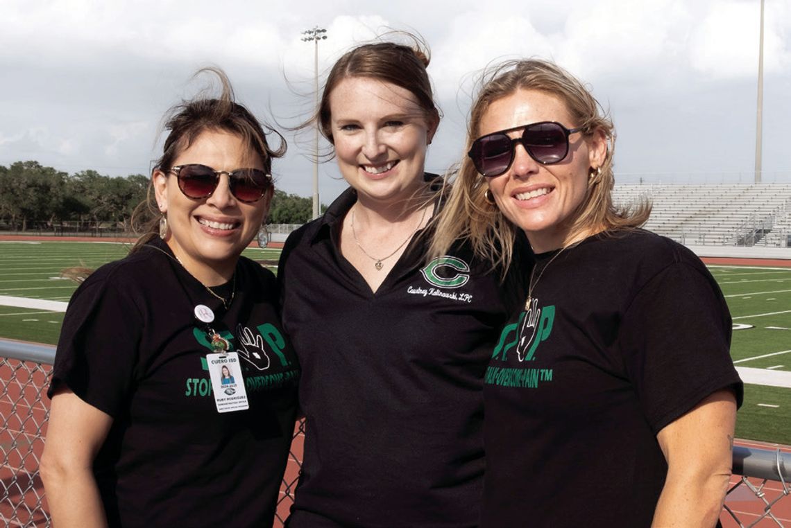 Director of special program Ruby Rodriguez, with School Climate Specialists Courtney Kalinowski and Lacy Timpone, raise awareness of the availability of Mental health resources. (Photo by Ele Chew)