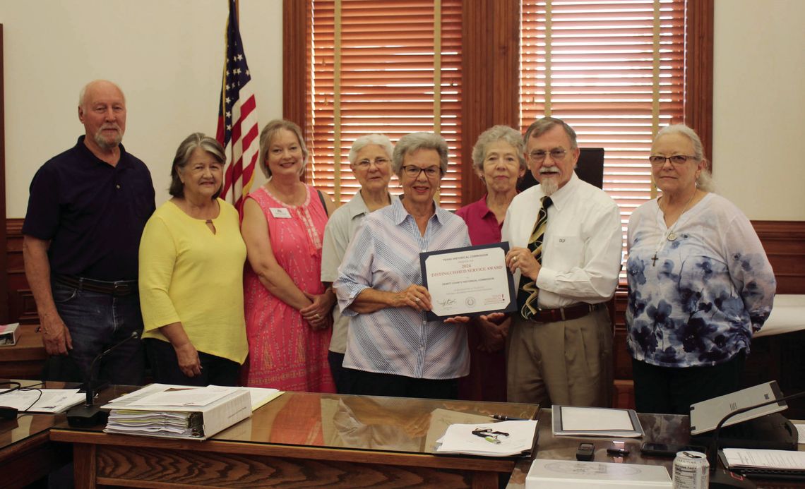 Members of the DeWitt County Historical Commission gather around County Judge Daryl Fowler at Monday’s Commissioner’s Court to celebrate the 2024 Distinguished Service Award from the Texas Historical Commission