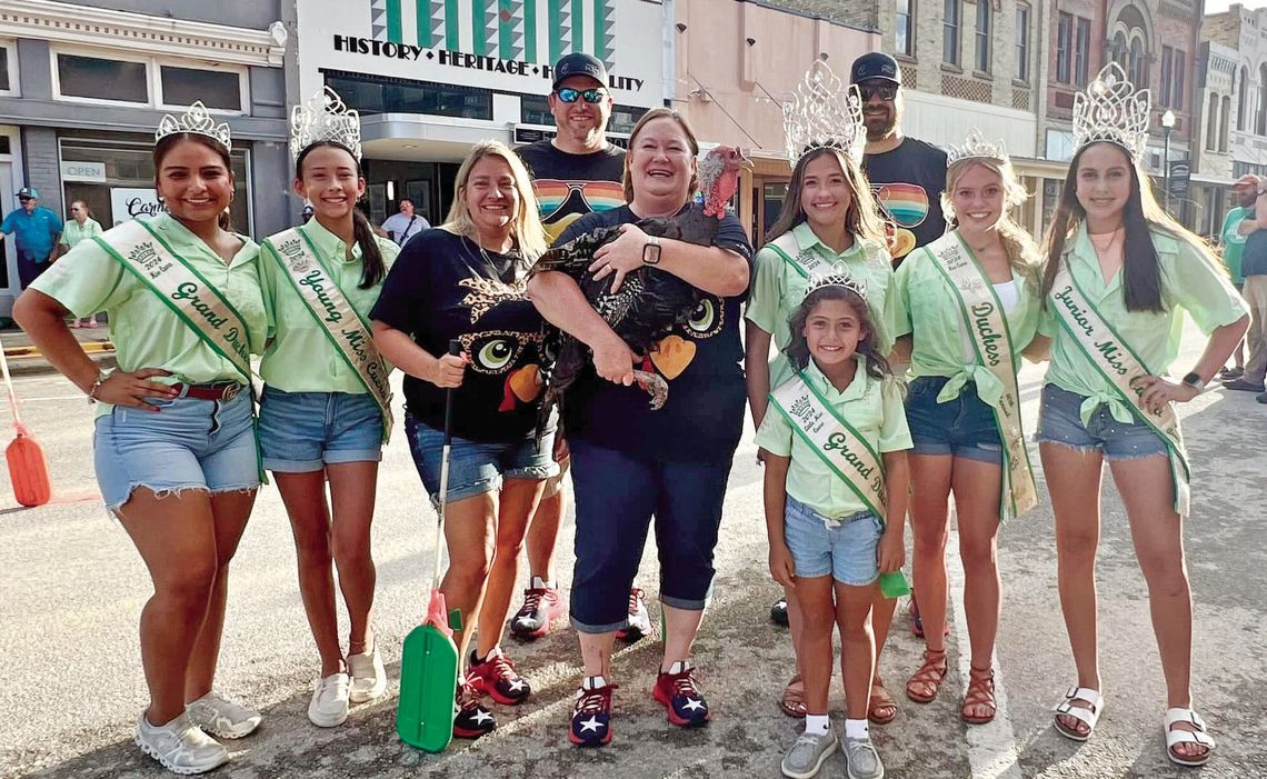 After the Rally for Ruby on Saturday, the Miss Cuero Court welcomed the newest Ruby Begonia as Cuero’s champion for this year’s Turkey Trot. (L-R) Jaslyn Pena, Bailey Woods, Sherry Oakes, Leslie Voelkel (holding “Ruby”), Miss Cuero Emily Woods, Keely Bryan and Maria Gonzales. In front is J...