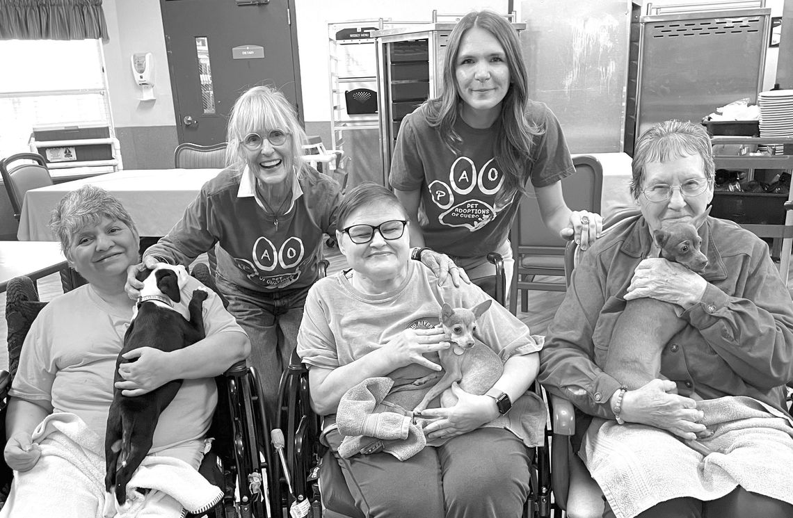 Puppy Love, not just for kids Pet Adoptions of Cuero Ambassadors Lizzie Rosson and Camryn Lake share some puppy love with residents at Cuero Nursing and Rehab. Both the residents and the puppies enjoyed the extra affection. (Contributed Photo)