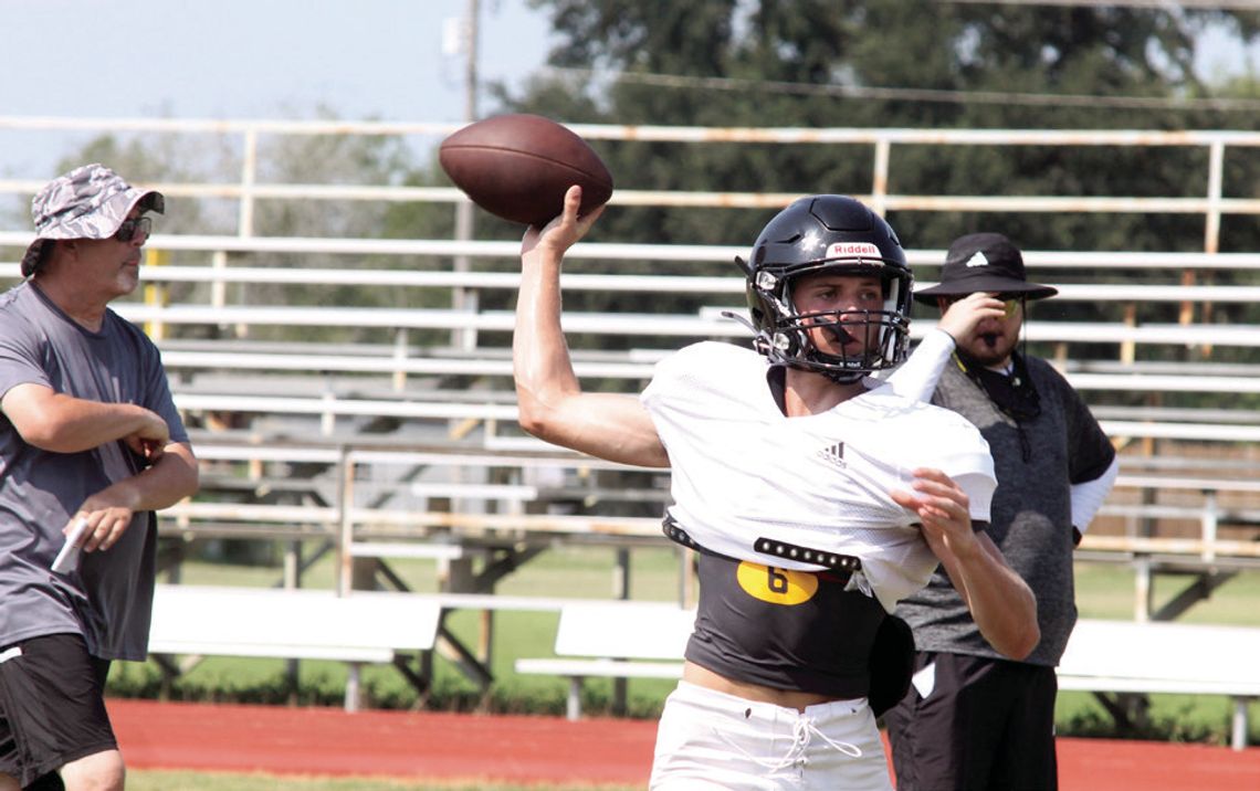 Quarterback Brody Metting passes on a play.