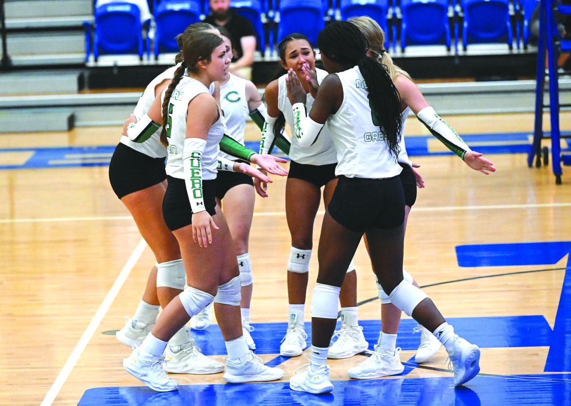 The Lady Gobblers celebrate a kill by Kyara Denson. The team prevailed over St. Joe 3-1. (Submitted Photo)