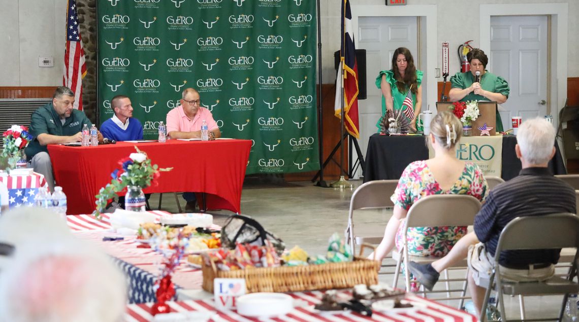 Executive Director of the Cuero Chamber of Commerce Angie Cuellar welcomes the audience to a Candidate Forum, which started with the three candidates for two at-large city council seats. From left are, Adam Arroyo, Russell Mobley and Charles Tounley.