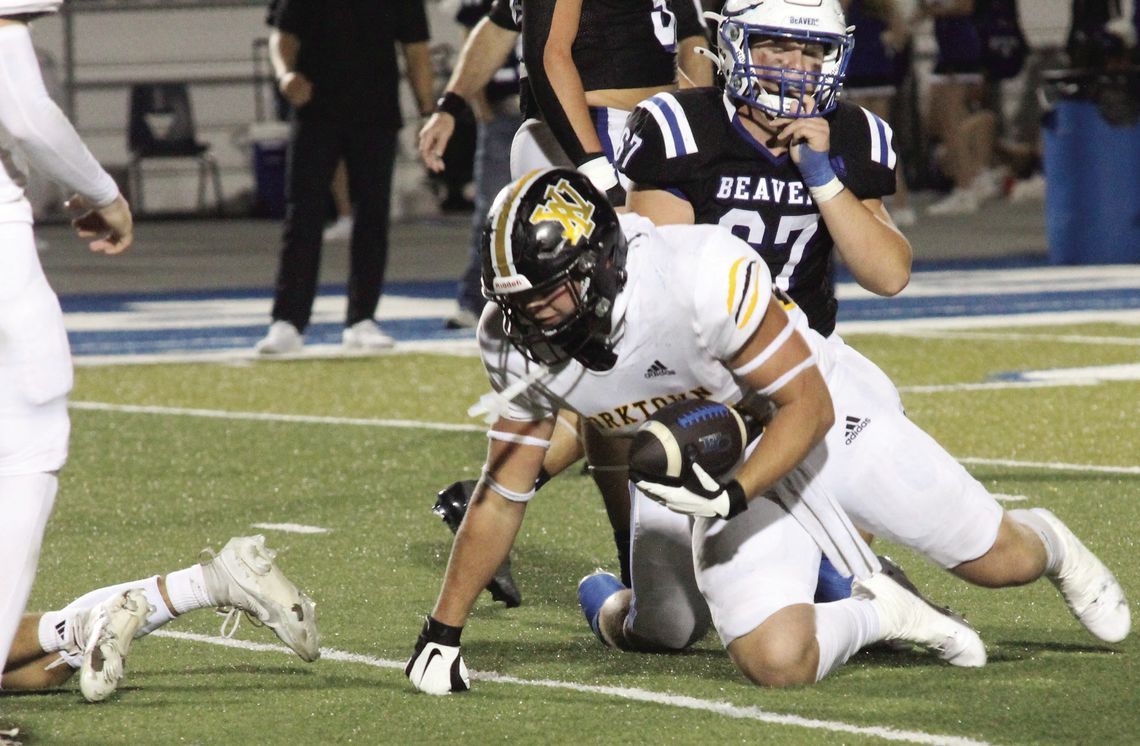 Rau picks up a fumble against the Beavers. PHOTOS BY DEIRDRE ALEXANDER