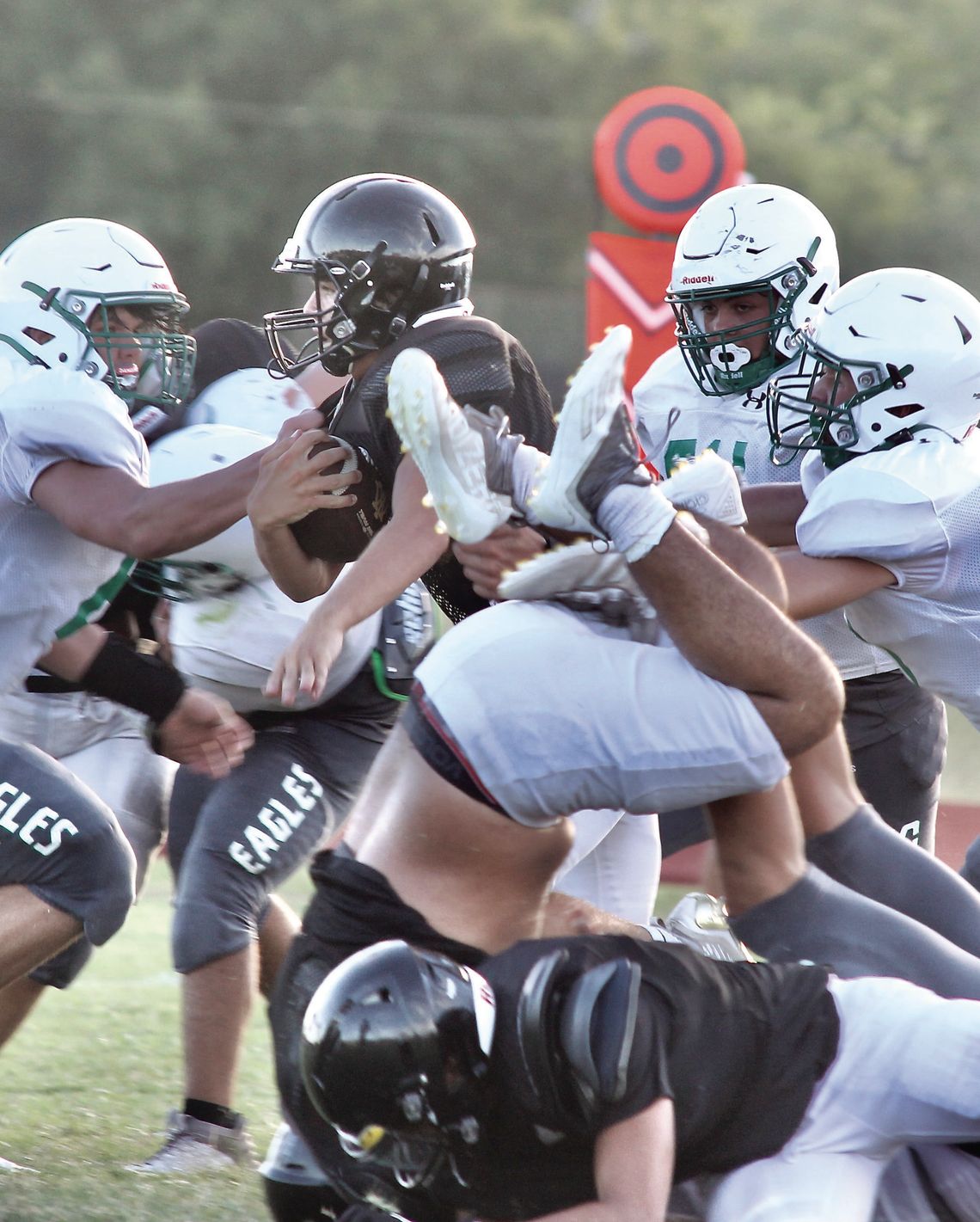 A Wildcat charges upfield with a slew of defenders trying to bring him down. PHOTOS BY DEIRDRE ALEXANDER